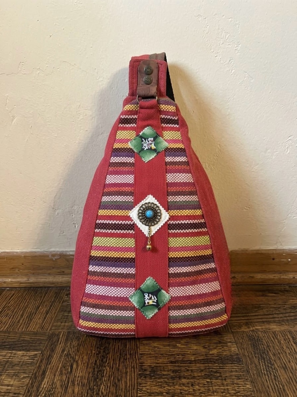 Bohemian-style teardrop sling backpack
